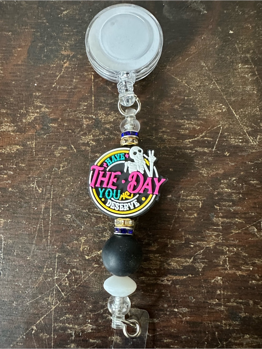 Handmade Colorful Skeleton 'Have The Day You Deserve' Badge Reel